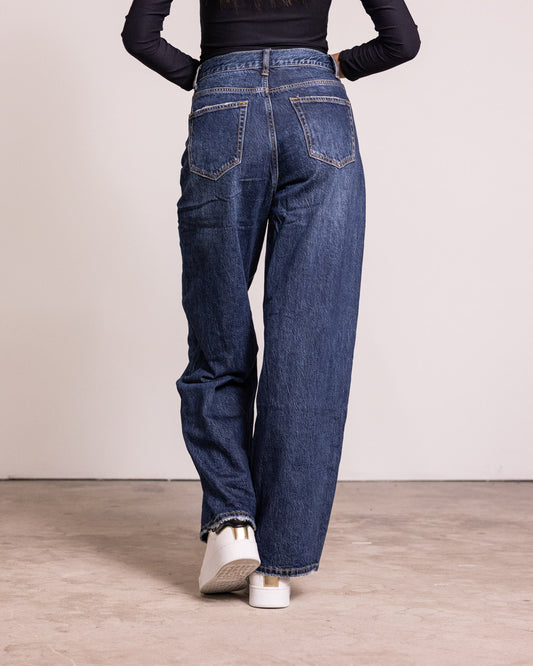 Jeans palazzo con chiusura asimmetrica