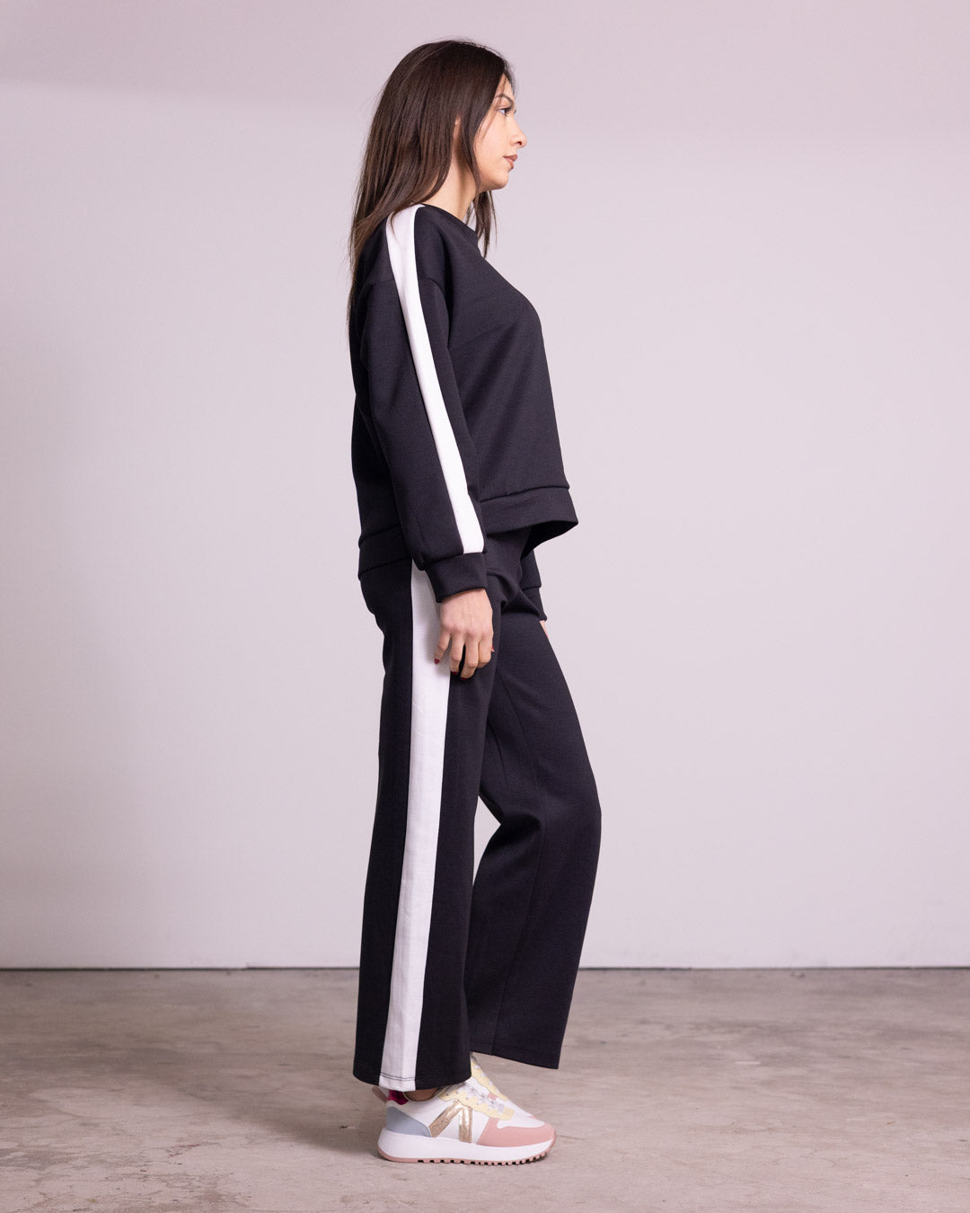 Tuta completa con banda laterale