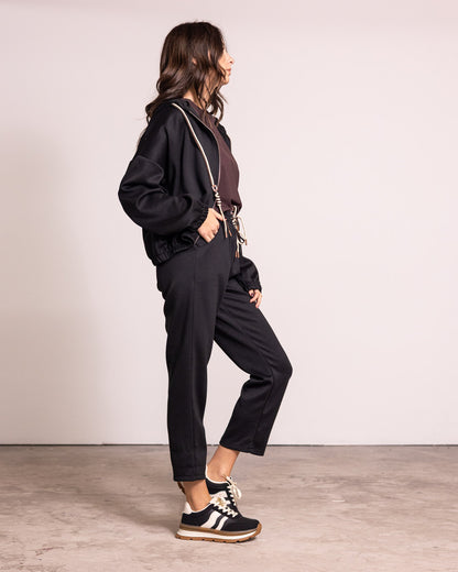 Tuta completa con zip e cappuccio