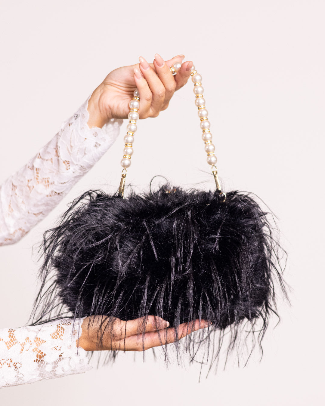 Feather bag with pearl handle